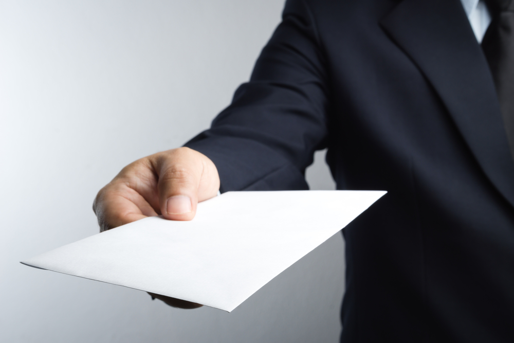 A professional completing paperwork during a field attendance